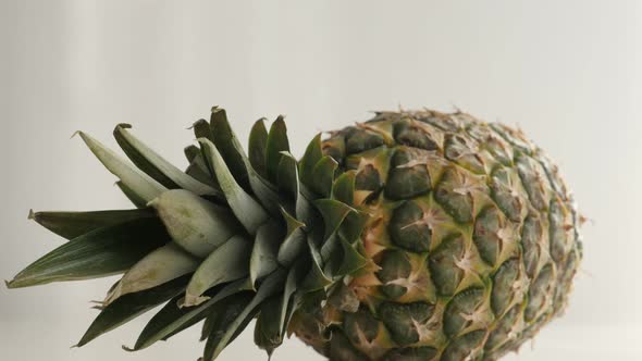 Details of tropical pineapple fruit slow tilt 4K 2160p 30fps UltraHD  footage - Whole Ananas comosus alt