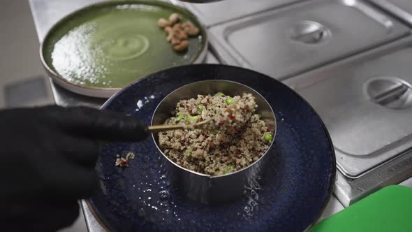 Fresh Quinoa Tabbouleh Salad with Olives, Served on Plate by Chef alt