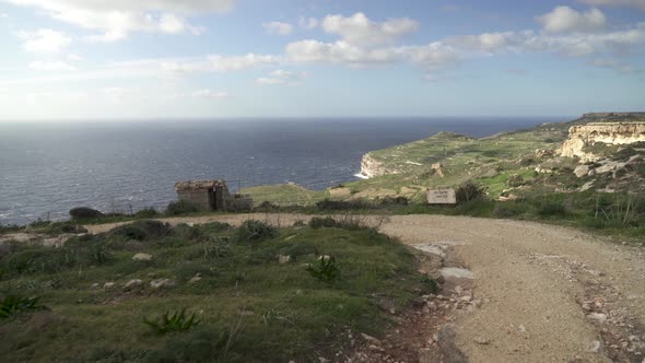 Rocky Road on a Windy Day Leading to Coastline near Mediterranean Sea in Malta