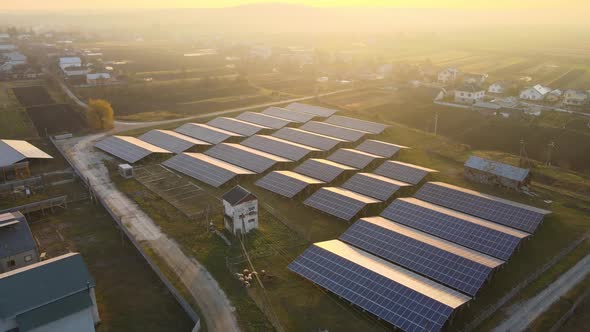 Aerial View of Large Sustainable Electrical Power Plant with Rows of Solar Photovoltaic Panels for alt