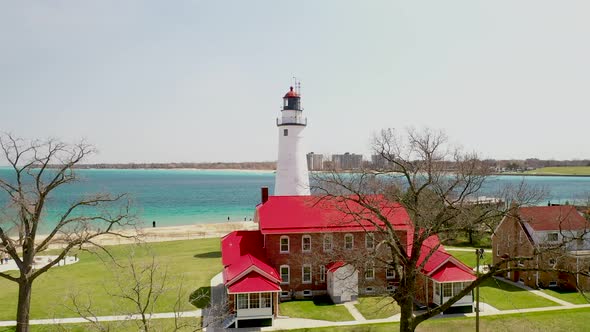 Fort Gratiot Lighthouse in Port Huron, Michigan with drone videoing up. alt