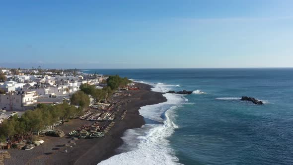 Aerial view of Kamari beach on Santorini island alt