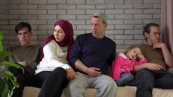 Authentic muslim family gets bored on the couch at home during Covid-19 lockdown alt