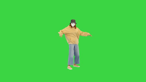 Girl Hip Hop Dancer in Casual Clothes Dance Chill and Relax Hiding Face Under Anonymous Phantom Mask