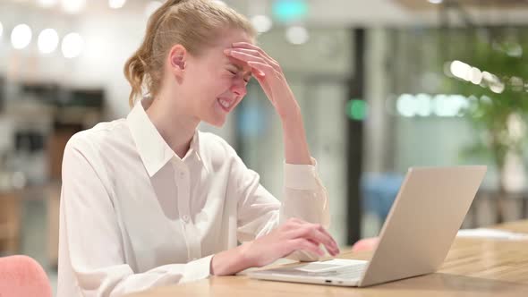 Stressed Businesswoman with Laptop Having Headache alt