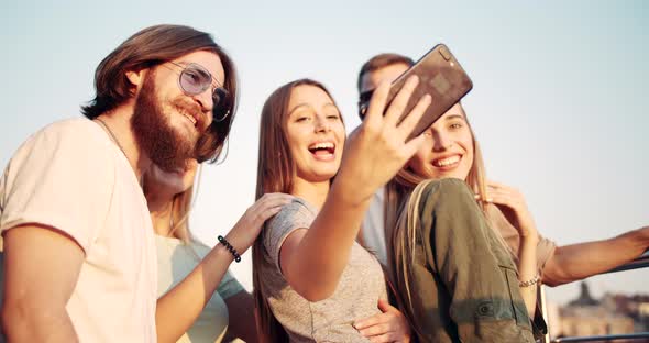 Friends Making Selfie at Sunset