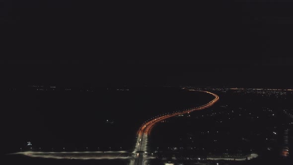 Aerial view of Night highway with orange and white lanterns and lightning 14 alt