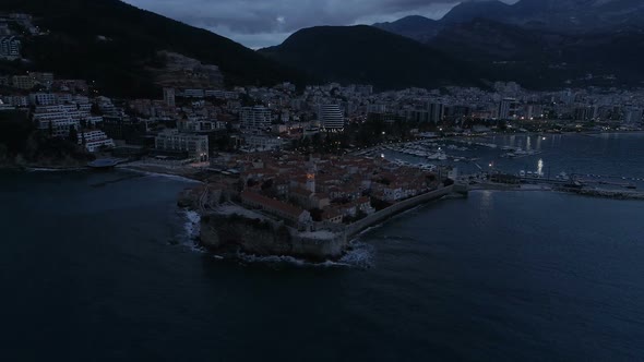 Aerial View of Coastal Old Town Budva with Medieval Buildings at Dusk