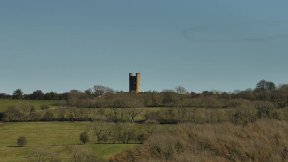 Broadway Tower Old English Cotswold Stone Building Aerial View With Insect Ring Swarm Overhead