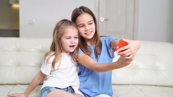 Cheerful Girls Take Selfies Communicate Via Video Communication Over Internet alt