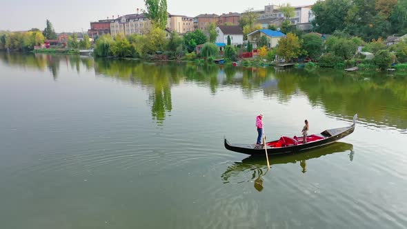 Aerial view of gondola ridingon river.  alt
