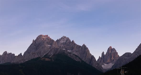 Sunset time lapse of alpine mountain range in 4k. Tyrol alps near  Sexten, Bolza alt
