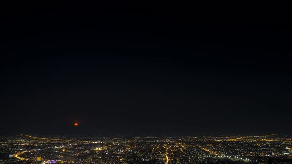 Time lapse of Chiang mai city night, Thailand with moon raise from the view point