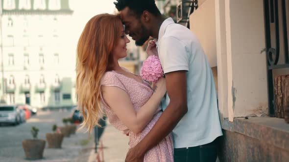 Young Couple in Love Standing and Tenderly Cuddling on Streets of European Cities alt