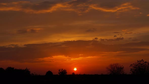 Clouds dramatic at sunset rural farm meadow horizon view alt