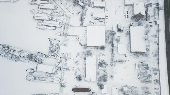 Flying on a Drone Directly Above the Shipyard and the Stand Where the Ships are Frozen in the Ice