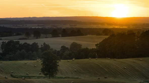 Fields on a Hills During Sunset with Golden Sunlight Time Lapse.