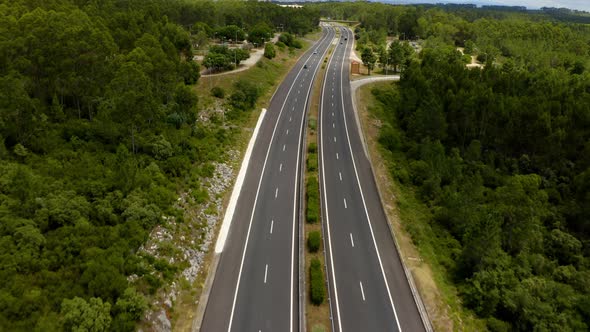 Traffic motion on a highway road in the mountains.  alt