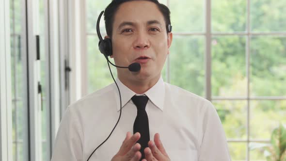Video Call Camera View of Businessman Talks Actively in Videoconference alt