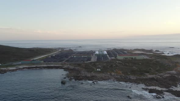 Amazing drone aerial landscape view of a Sea farm on land at sunset in Galiza, Spain alt