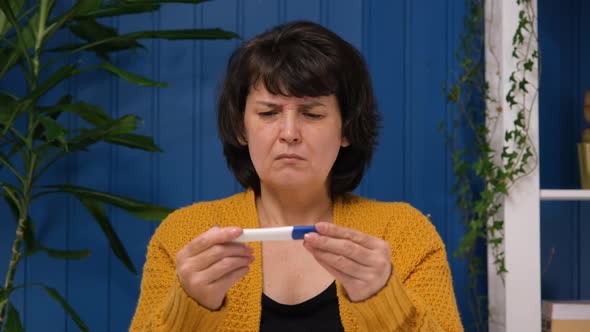 Middle Aged Woman Worried with Negative Pregnancy Test