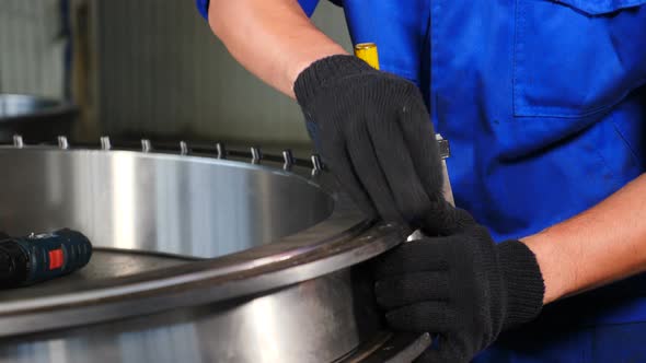 Industry and Machinery Concept. Hand Manufacture of Bearings at Factory. Bearing Production and alt