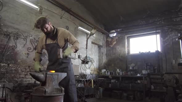 Craftsman Making Decorative Element in Smithy alt