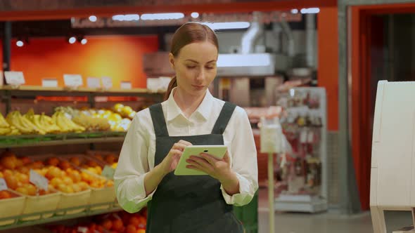Young Store Manager Types Information About Greengroceries alt