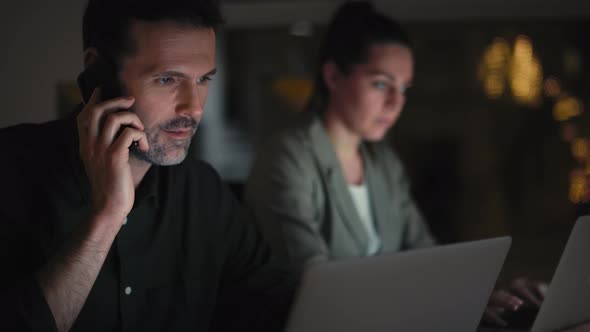 Caucasian colleagues working together at the office. Shot with RED helium camera in 8K. alt
