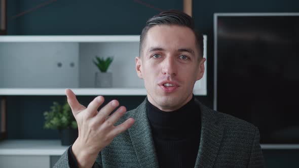 Portrait of Cheerful Business Man Talking at Webcam and Making Conference Online Video Call. Young alt