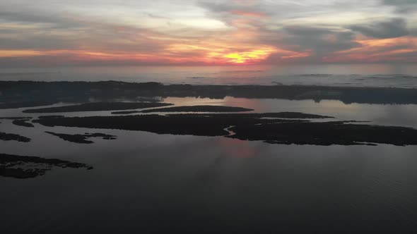Aerial shot of the river at sunset.It is the final part of the river, mouth to the sea. alt