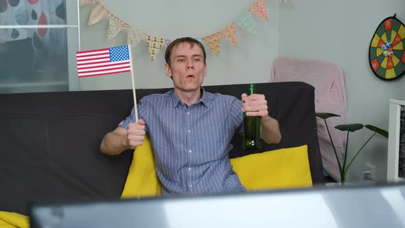 Man Supporting US National Team on TV at Home alt