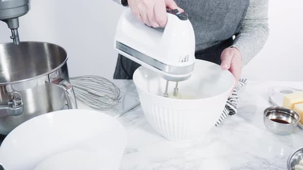 Step by step. Mixing ingredients in standing kitchen mixer to bake funfetti cake alt