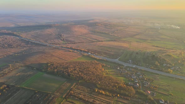 Aerial Panorama View Awesome Evening Sunset in Below Valley with Mountain Road alt