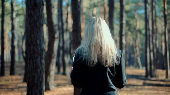 Woman Explore New Route.Woman Paper Map Path.Traveler Explore Forest With Map.Girl Holding Map. alt