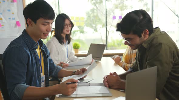 asian interviewer team of recruiters with laptop pc having interview