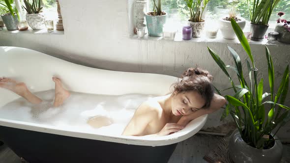 Woman enjoying bathing.