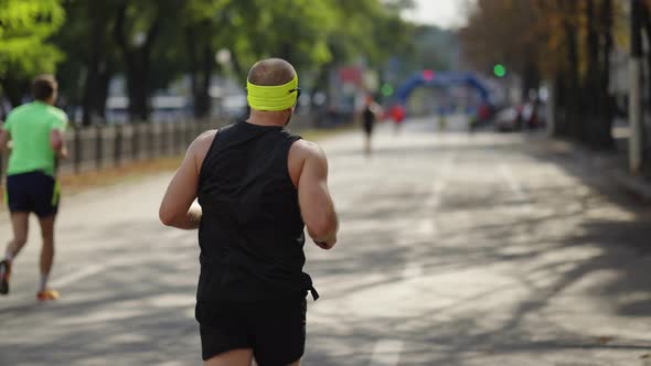 Marathon Runner Approaching Finish Line alt