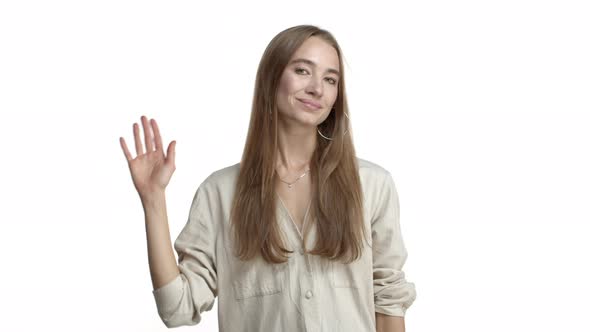 Studio Shot of Caucasian Adult Woman in Casual Beige Blouse Smiling and Wave Away Humble Express Her alt