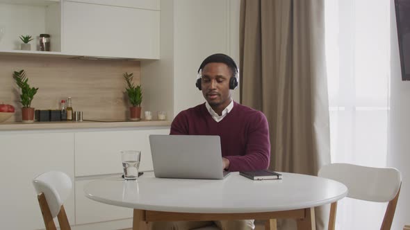 Young Adult African American Black Male Working From Home Call Center Employee alt