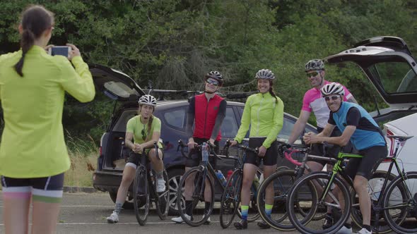 Group of cyclists taking group photo together.  Fully released for commercial use.