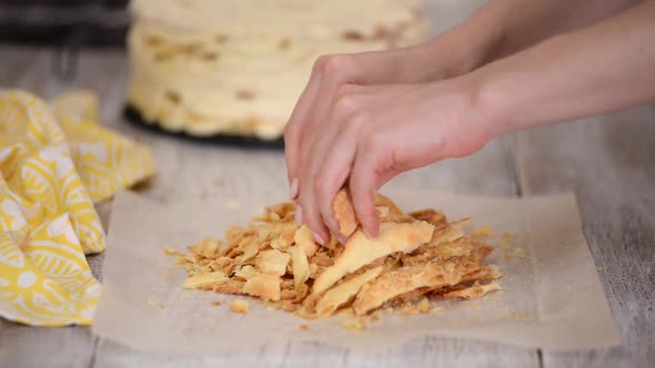 Woman Hands Making Crumble for Napoleon Cake