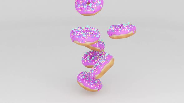 many fresh pink glazed donuts rotating close-up
