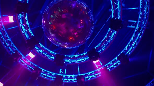 Stage lights and disco ball in club with smooth movement. Many colors and reflections at party indoo alt