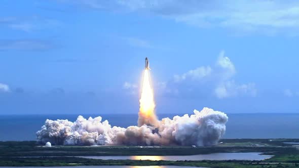 Space Shuttle Lifting Off Over Water. Discovery shuttle background