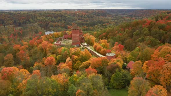 Aerial Autumn Landscape View of the Old Turaida Castle Colorful Trees  Latvia, Sigulda 4K Video alt