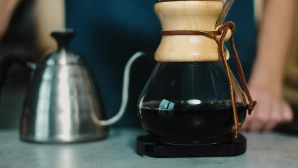 Process of making espresso in a coffee machine. Barista making latte in  specialty coffee shop. alt