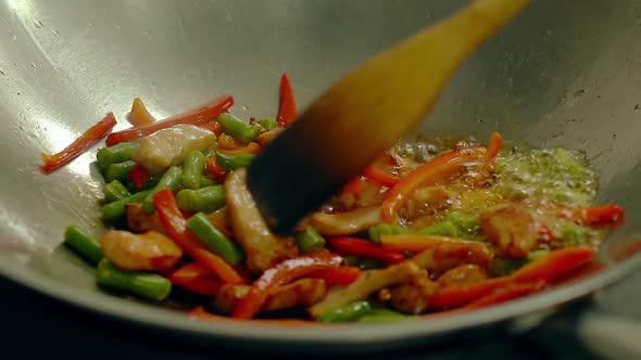 Cook Prepares in a Frying Pan, in Oil, with Fresh Vegetables - Potatoes, Tomatoes, Green Beans alt
