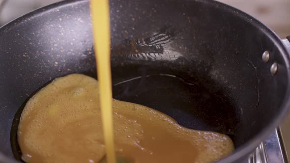 Close up of the fried egg in a pan for breakfast alt