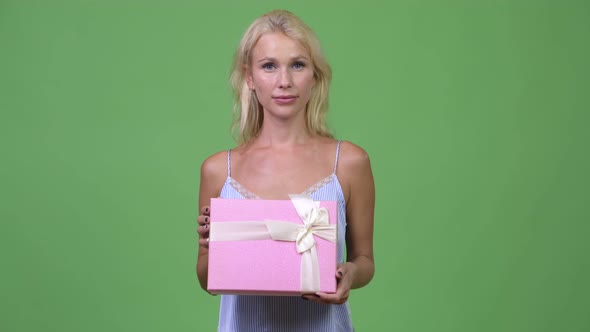 Young Happy Beautiful Businesswoman Holding Gift Box
